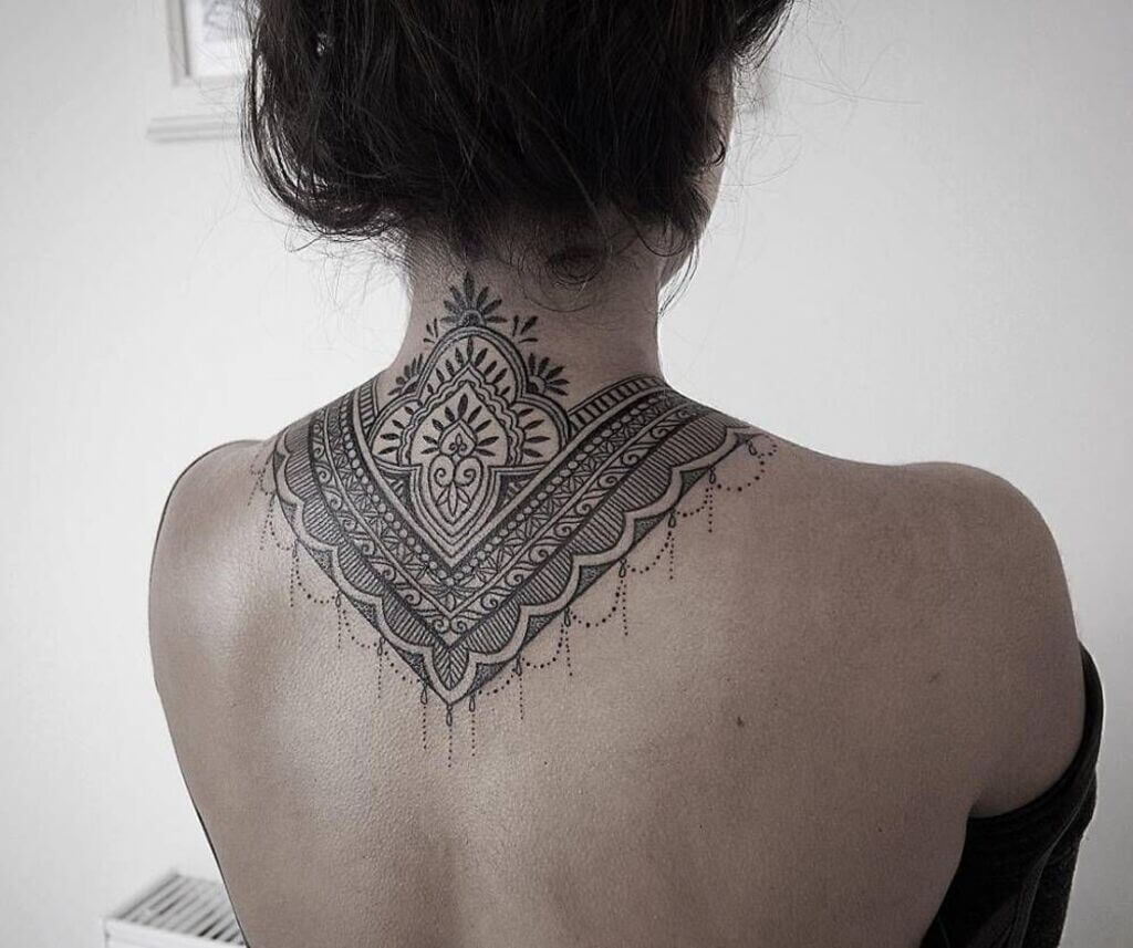 feminine upper back tattoos