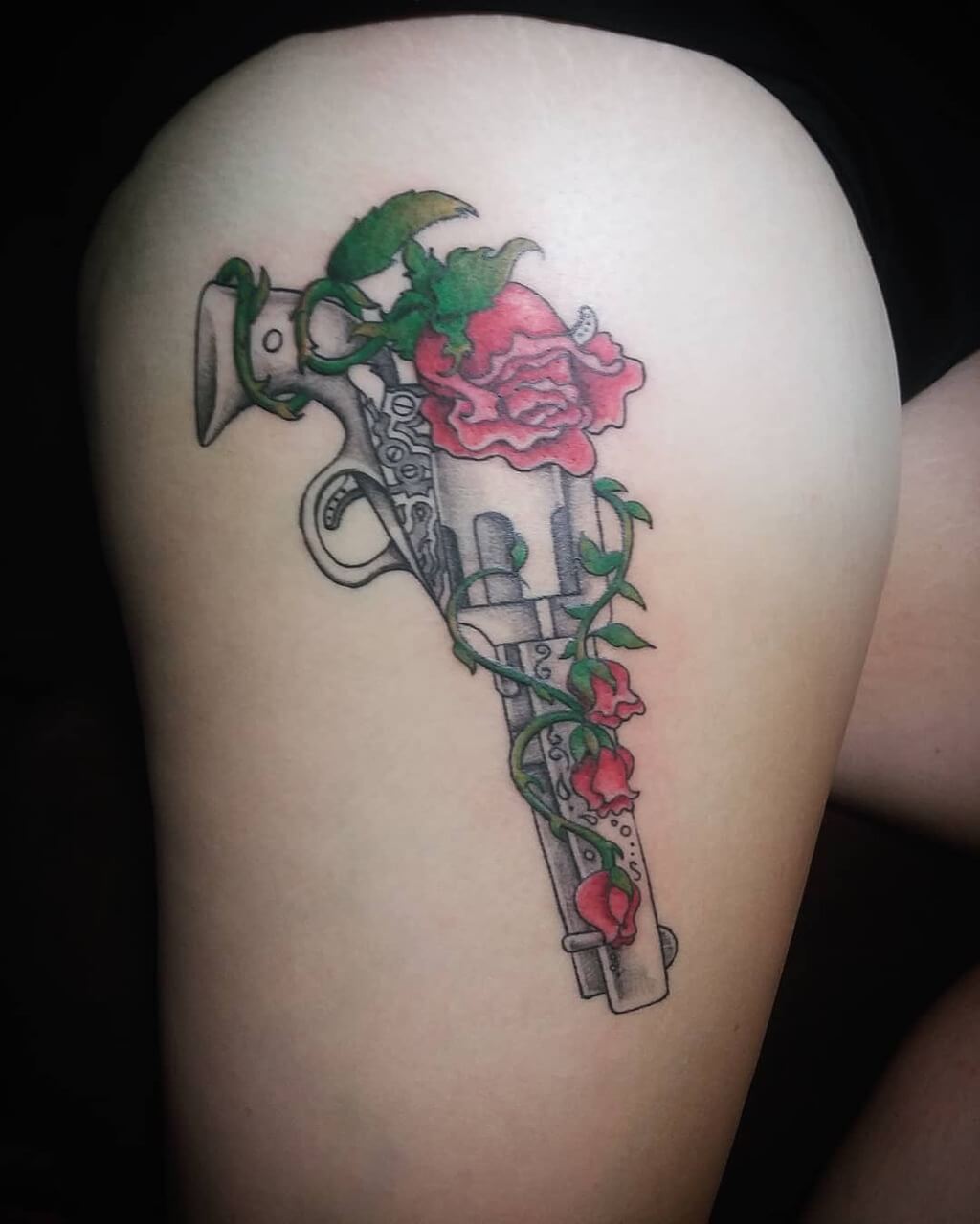 Downers Grove Tattoo Co  Gun with daisy on thigh  Facebook