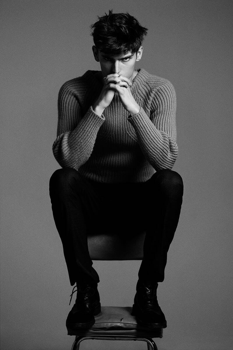 male model poses for photography