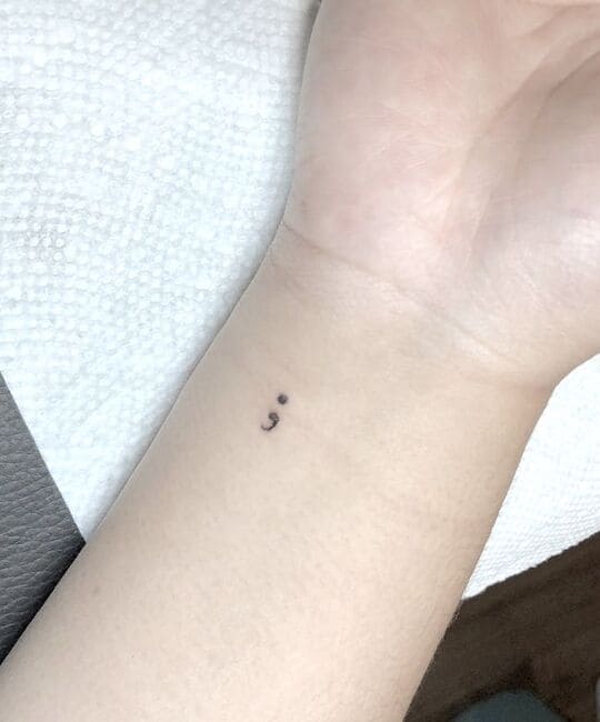 Small meaningful Semicolon tattoo
