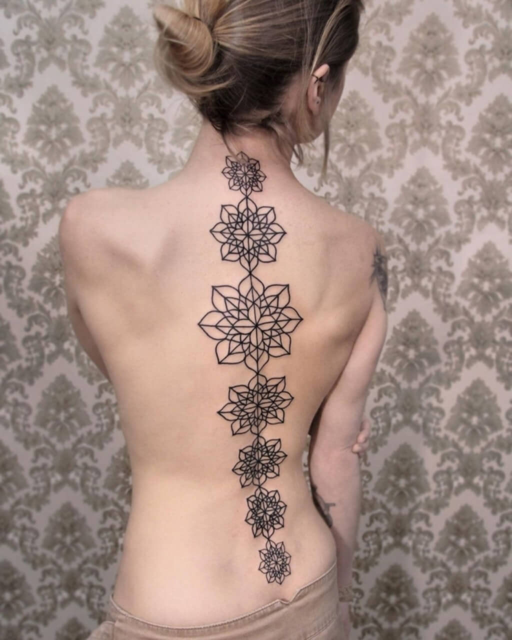 spine back tattoos womens