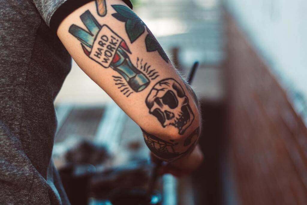 low arm tattoo