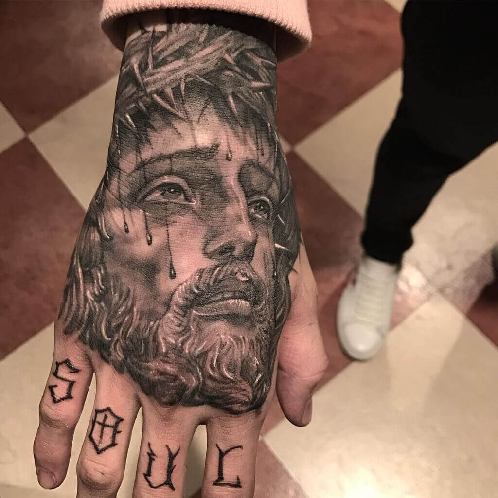 Tatuagem de mão de Jesus Cristo