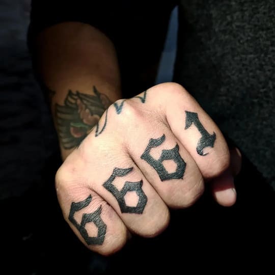 men finger tattoos